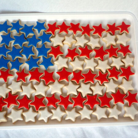 Star cookies placed on a platter in the shape of the American flag